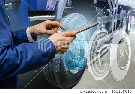 Serviceman repairing a truck 101168016