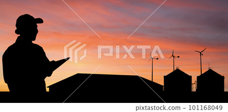 Silhouettes of farmer with tablet computer and dairy farm 101168049