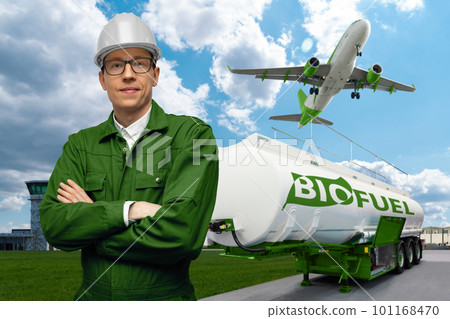 Engineer on a background of airplane and biofuel tank trailer. 101168470