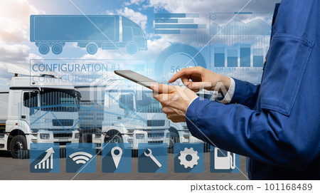 Manager with a digital tablet next to trucks. 101168489