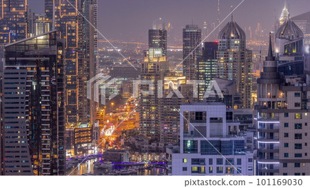 Dubai Marina and Media City districts with modern skyscrapers and office buildings aerial day to night timelapse. 101169030