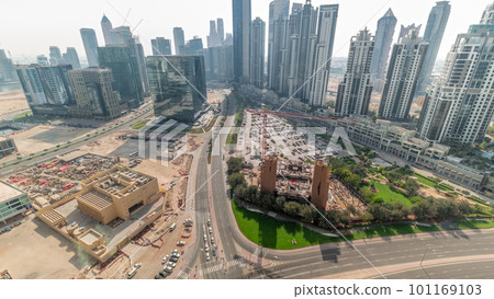 Bay Avenue with modern towers residential development in Business Bay aerial panoramic all day timelapse, Dubai Bay Avenue with modern towers residential development in Business Bay aerial panoramic all day timelapse, Dubai 101169103