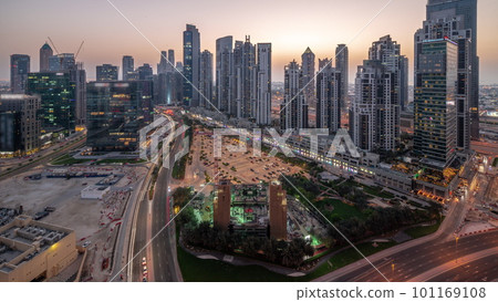 Bay Avenue with modern towers residential development in Business Bay aerial panoramic day to night timelapse, Dubai Bay Avenue with modern towers residential development in Business Bay aerial panoramic day to night timelapse, Dubai 101169108