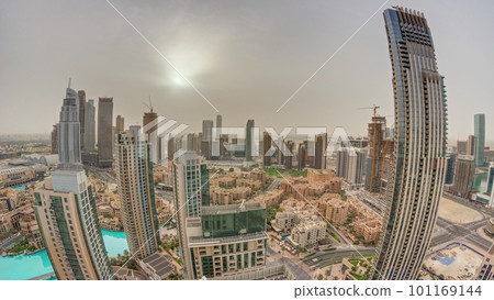 Aerial panorama with sunrise over big futuristic city timelapse. Business bay and Downtown Aerial panorama with sunrise over big futuristic city timelapse. Business bay and Downtown 101169144