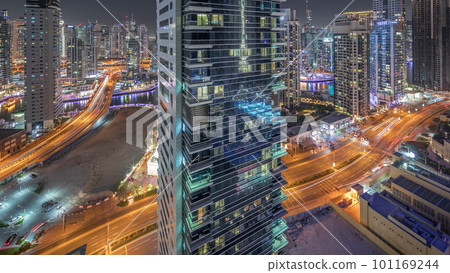 Panoramic view of the Dubai Marina and JBR area and the famous Ferris Wheel aerial night timelapse Panoramic view of the Dubai Marina and JBR area and the famous Ferris Wheel aerial night timelapse 101169244