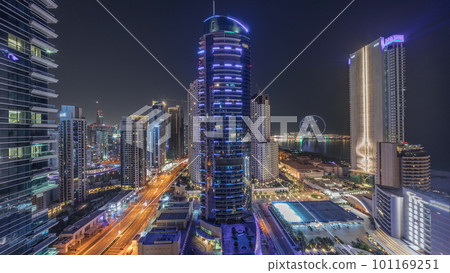 Panoramic view of the Dubai Marina and JBR area and the famous Ferris Wheel aerial night timelapse 101169251