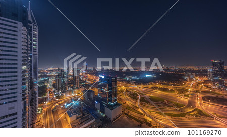 Aerial view of media city and al barsha heights district area all night timelapse from Dubai marina. 101169270