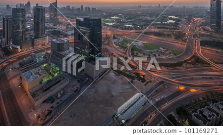 Aerial view of media city and al barsha heights district area night to day timelapse from Dubai marina. Aerial view of media city and al barsha heights district area night to day timelapse from Dubai marina. 101169271