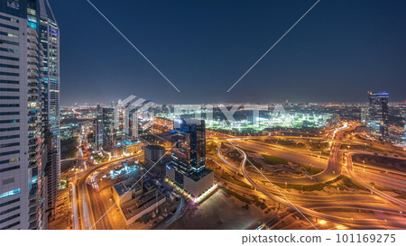 Aerial view of media city and al barsha heights district area day to night timelapse from Dubai marina. Aerial view of media city and al barsha heights district area day to night timelapse from Dubai marina. 101169275