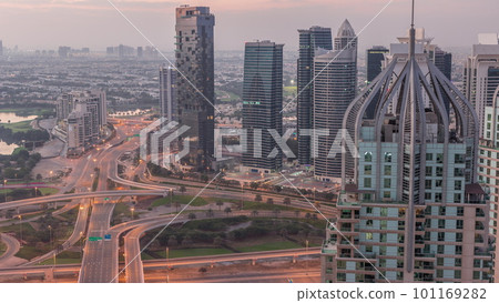 Huge highway crossroad junction between JLT district and Dubai Marina night to day timelapse. Huge highway crossroad junction between JLT district and Dubai Marina night to day timelapse. 101169282