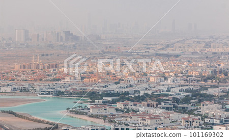 Aerial view of many apartment houses in Dubai city from above timelapse 101169302