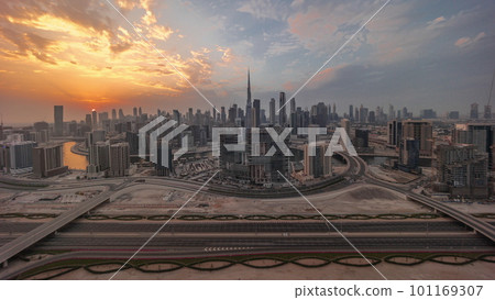 Sunset over panoramic skyline of Dubai with business bay and downtown district timelapse. 101169307