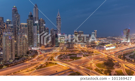 Dubai Marina highway intersection spaghetti junction day to night timelapse 101169427