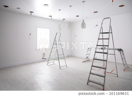 Empty room with stretch ceiling and ladders 101169631