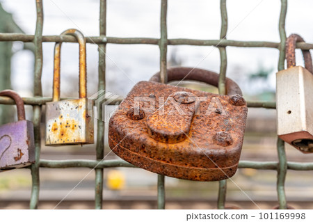 rusty metal lock on the bridge rusty metal lock on the bridge 101169998