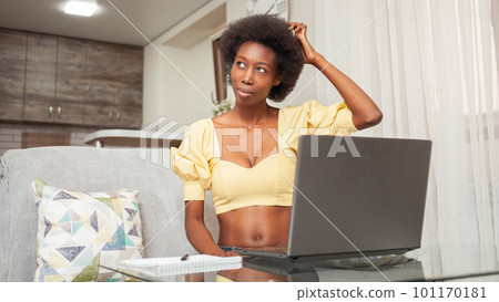 Portrait of African American Black Woman. Generating ideas, forget, think, brainstorm. Business plan, project, idea, freelance laptop work at home. Thinking Portrait of African American Black Woman. Generating ideas, forget, think, brainstorm. Business plan, project, idea, freelance laptop work at home. Thinking 101170181