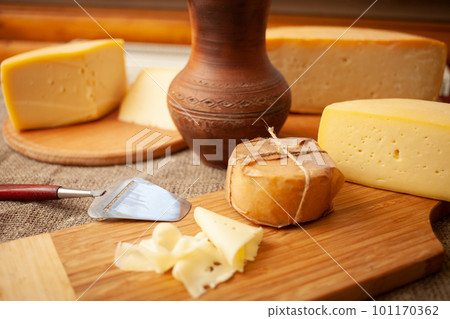 Beautiful background, cheese on wooden board, food. Home natural eco-friendly production, business. 101170362