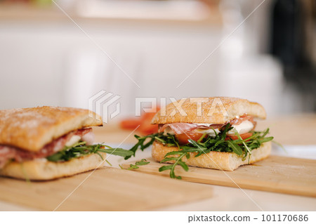 Two delicious Italian sandwich on wooden board. Healthy food concept 101170686