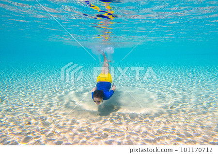 Child snorkeling. Kids underwater. Beach and sea. 101170712