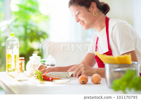 Woman cooking dinner. Cook spaghetti 101170795