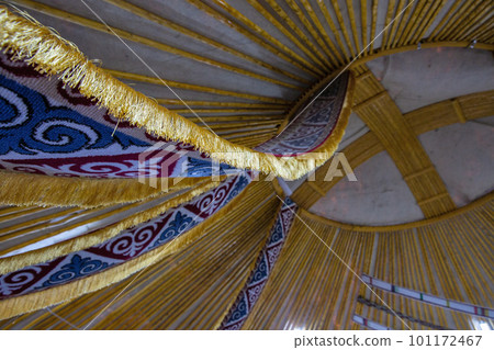 Kazakh yurt interior with round hole in the dome. 101172467
