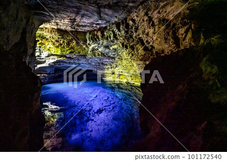 The blue water of Poco Encantado or Enchanted Well, in a cave at Itaete, Chapada Diamantina, Bahia, Brazil 101172540