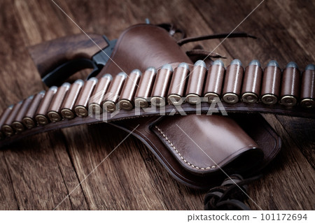 Old west leather gun belt with ammnunitions and revolver in holster Old west leather gun belt with ammnunitions and revolver in holster 101172694
