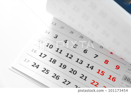 flipping through the pages of the flip calendar. flipping through the pages of the flip calendar. 101173454