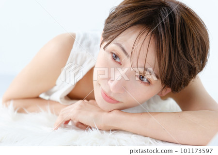 woman lying on white floor woman lying on white floor 101173597