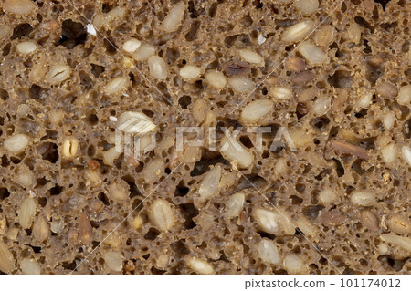 Black rye bread cut into chunks with sunflower seeds Black rye bread cut into chunks with sunflower seeds 101174012