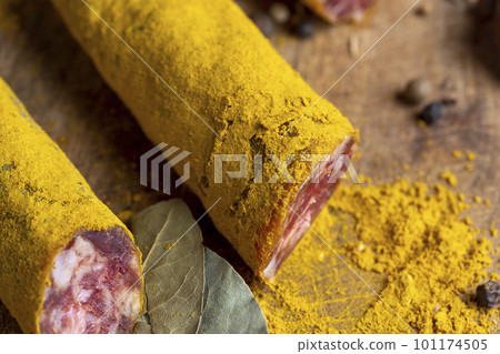 Sliced veal salami with turmeric 101174505