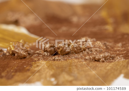 Abstract background painted with gold acrylic paints 101174589