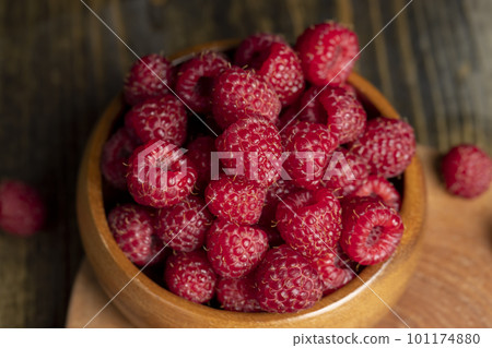 Harvested red ripe raspberries in the kitchen 101174880