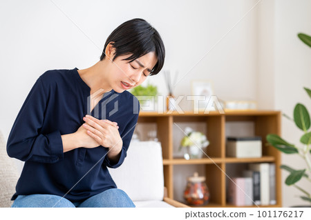 Young woman with chest pain 101176217