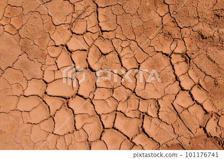 During long periods of drought ground has developed large crack texture that is dry in appearance. 101176741