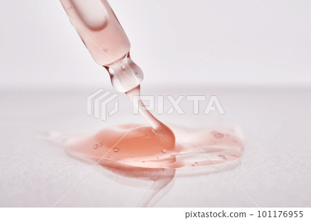 Pipette with a viscous pink cosmetic close-up. Pipette with a viscous pink cosmetic close-up. 101176955