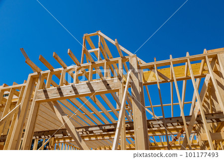 New residential under construction beams framing structure home wooden building frame on construction site New residential under construction beams framing structure home wooden building frame on construction site 101177493