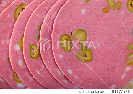 Close-up of sliced mortadela sausage with olives 101177526