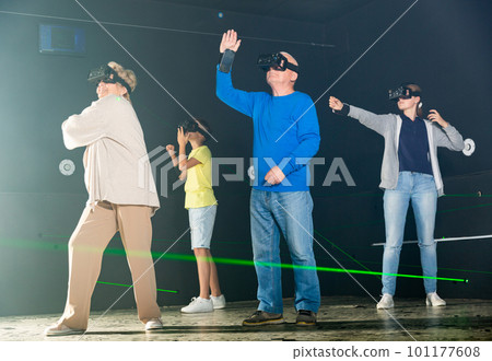 Grandparents and grandkids playing VR games together 101177608