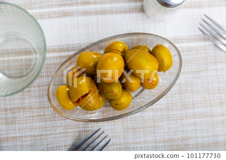Pickled green olives with a stone 101177730