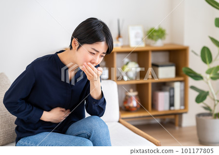 young woman feeling nauseous 101177805