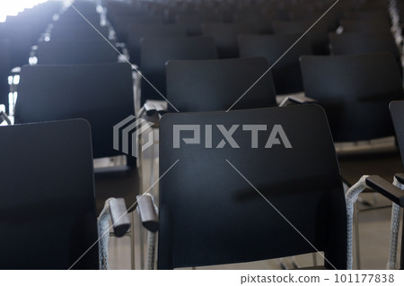 Plastic chairs in conference room 101177838
