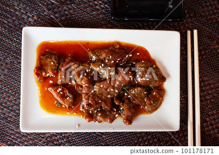 Wok with veal and sesame seeds. Japanese cuisine Wok with veal and sesame seeds. Japanese cuisine 101178171