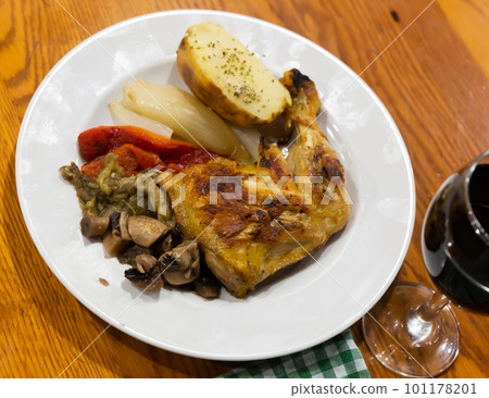 Tasty baked chicken legs and mushrooms 101178201