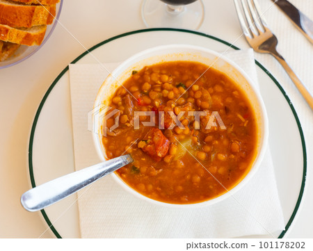 Spanish lentil stew served on table Spanish lentil stew served on table 101178202