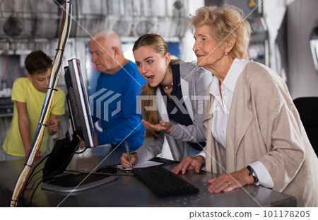 Positively minded family together solve puzzles in a quest room in form of an abandoned laboratory Positively minded family together solve puzzles in a quest room in form of an abandoned laboratory 101178205