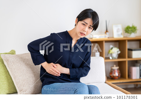 young woman with a sore side young woman with a sore side 101178301