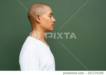 Profile view portrait of handsome bald man wearing t-shirt Profile view portrait of handsome bald man wearing t-shirt 101179180