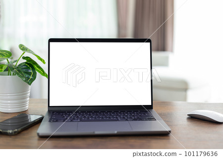 mock up empty screen computer on wood desk in home.Notebook Laptop with blank screen 101179636