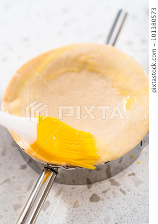 Filling empanada dough with cherry pie filling to make sweet cherry empanadas in the air fryer. 101180573